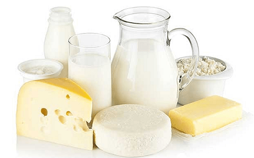 Bottles of milk and wheels of cheese