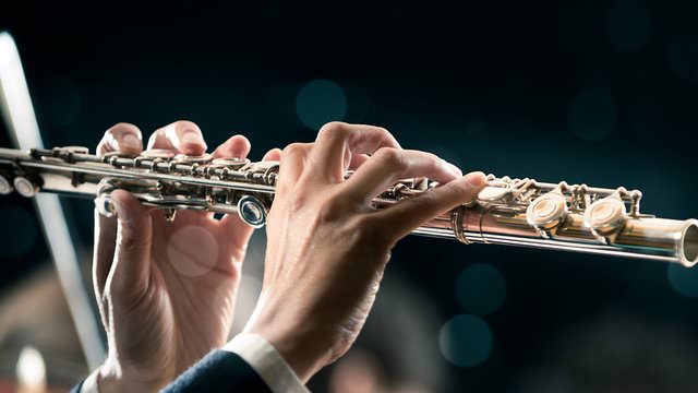 hands playing a clarinet