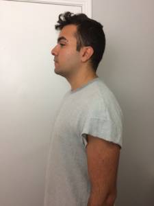 a man in a t-shirt as seen from the side