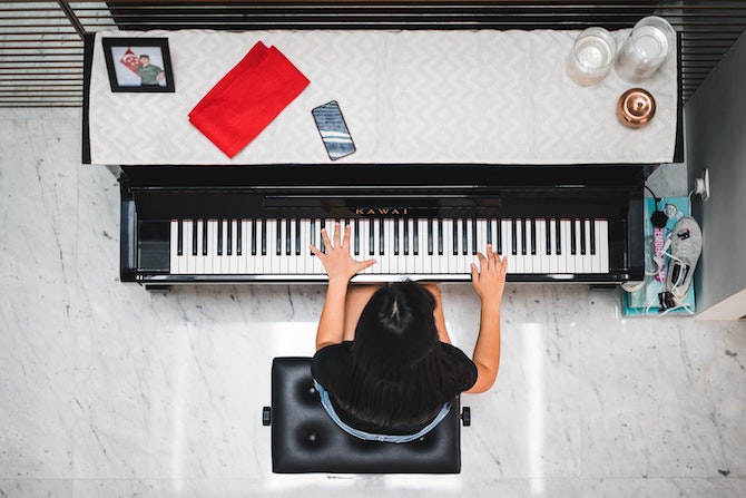 Young person playing Kawai piano