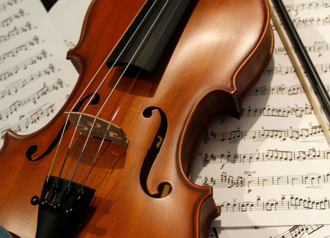 Violin on top of music sheets