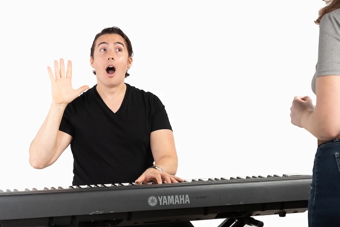 Vocal coach Matt Ramsey teaching female student